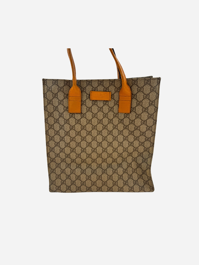 Gucci Supreme tote med monogrammønster, brune håndtag og en struktureret, rektangulær form.